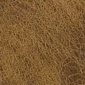 Distressed leather texture in caramel showcases irregular cracks, a matte finish, and subtle tonal variations evoking vintage wear.